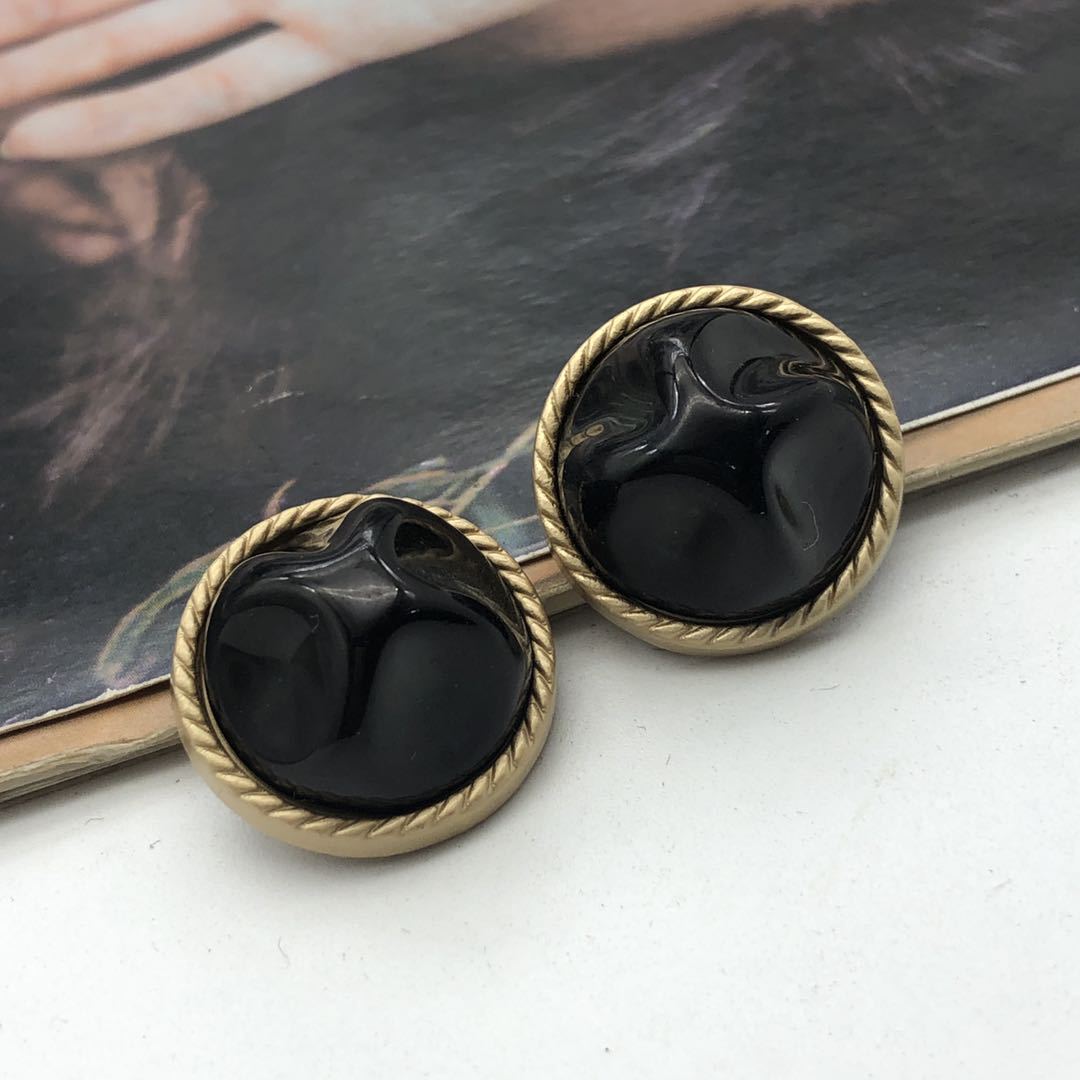 Round coat buttons, black stone-style center with gold-tone metal rim, 21mm (2 shown)