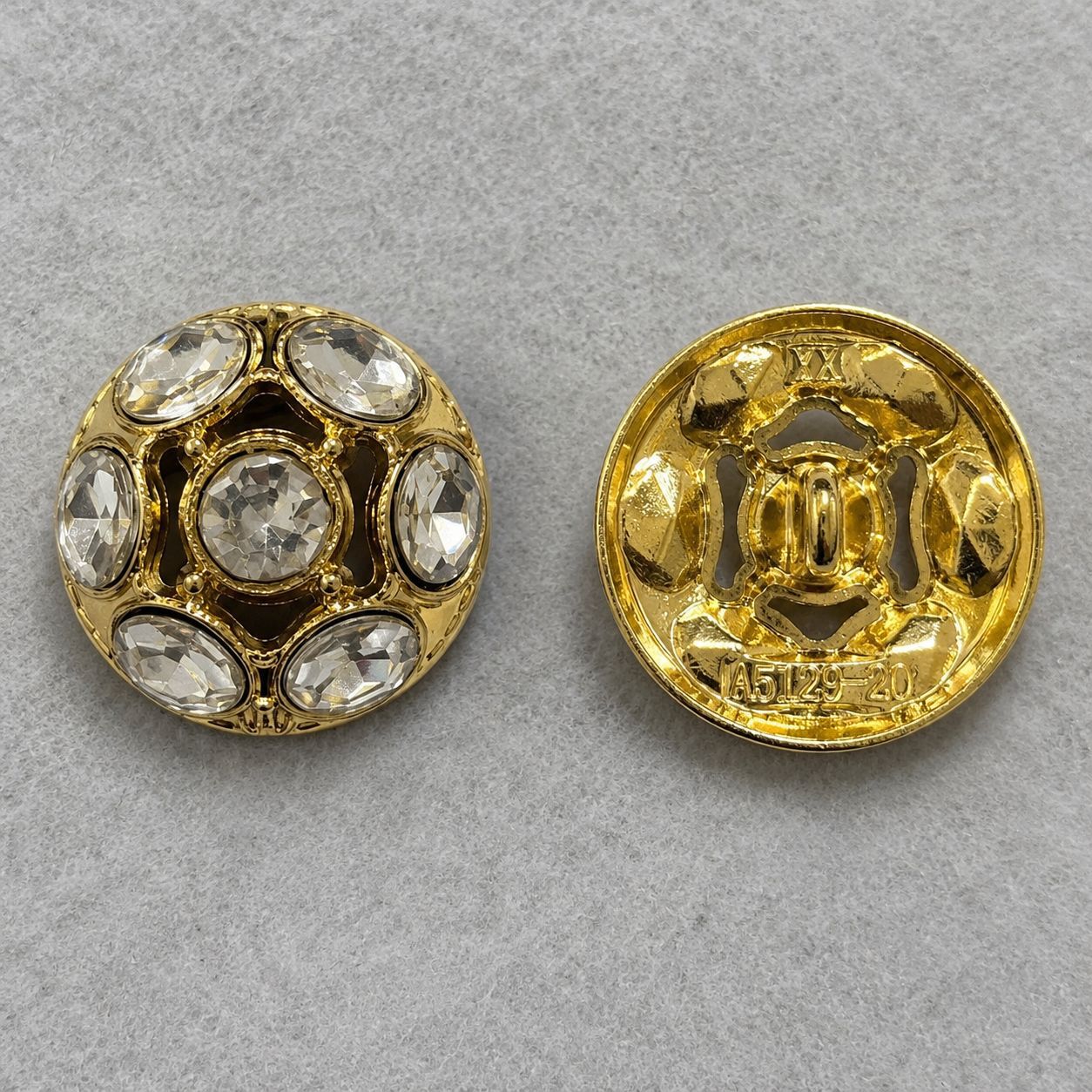 Gold domed metal shank button, front and back view with clear rhinestone trim