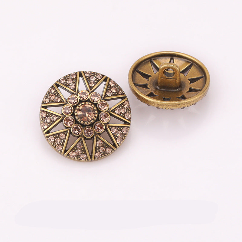 Hollow star crystal metal shank button pair, light gold tone, front and back.