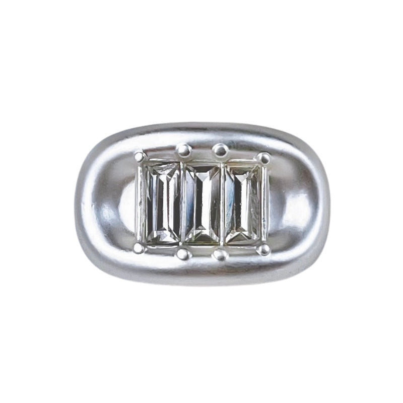 Bright silver ingot rhinestone metal shank button, oval frame with baguette stones