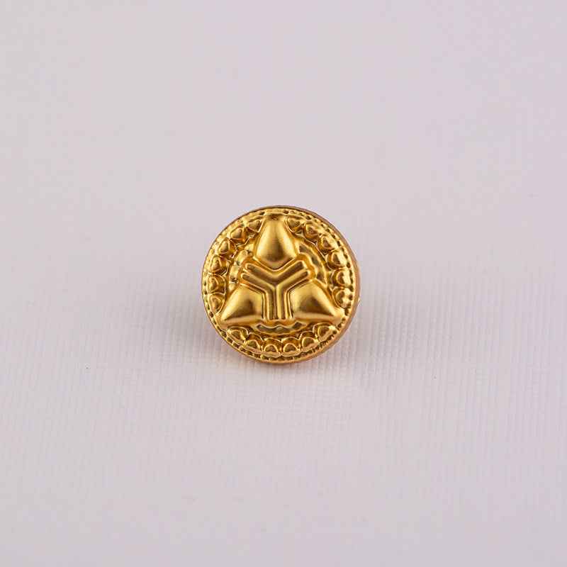 Gold Chinese-style shirt button with geometric arrow-cross emblem