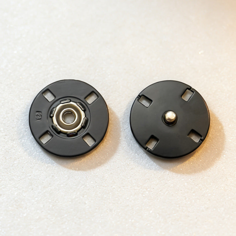 Round invisible metal snap buttons, matte black finish—stud and inner socket