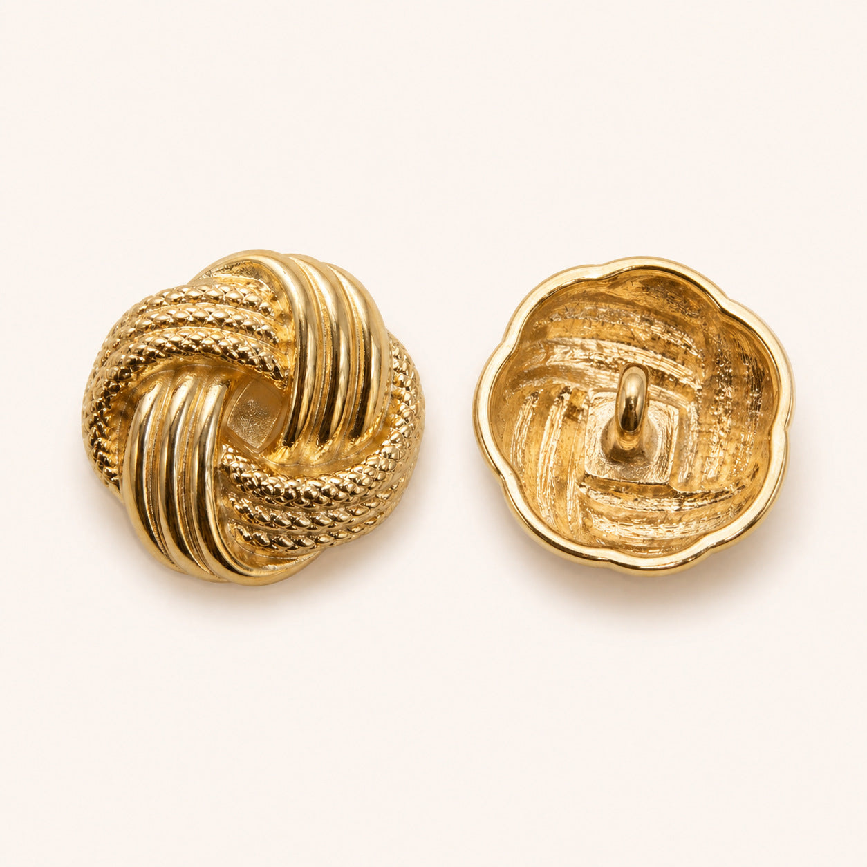 Gold metal Chinese knot shank button pair, front and back showing loop shank