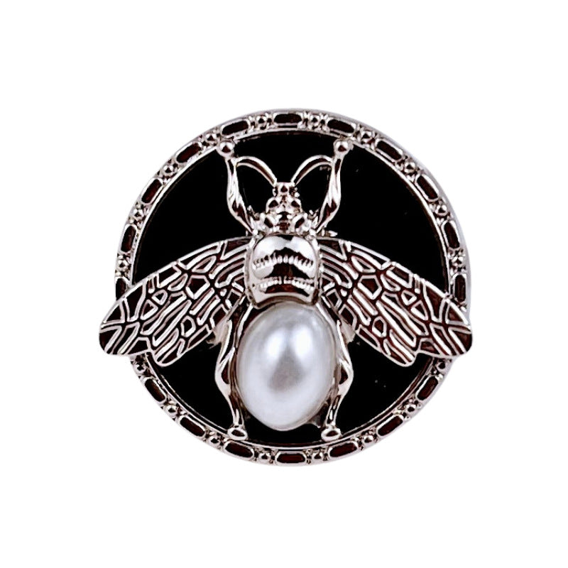Silver round bee pearl metal shank button, wings pattern and pearl center on black