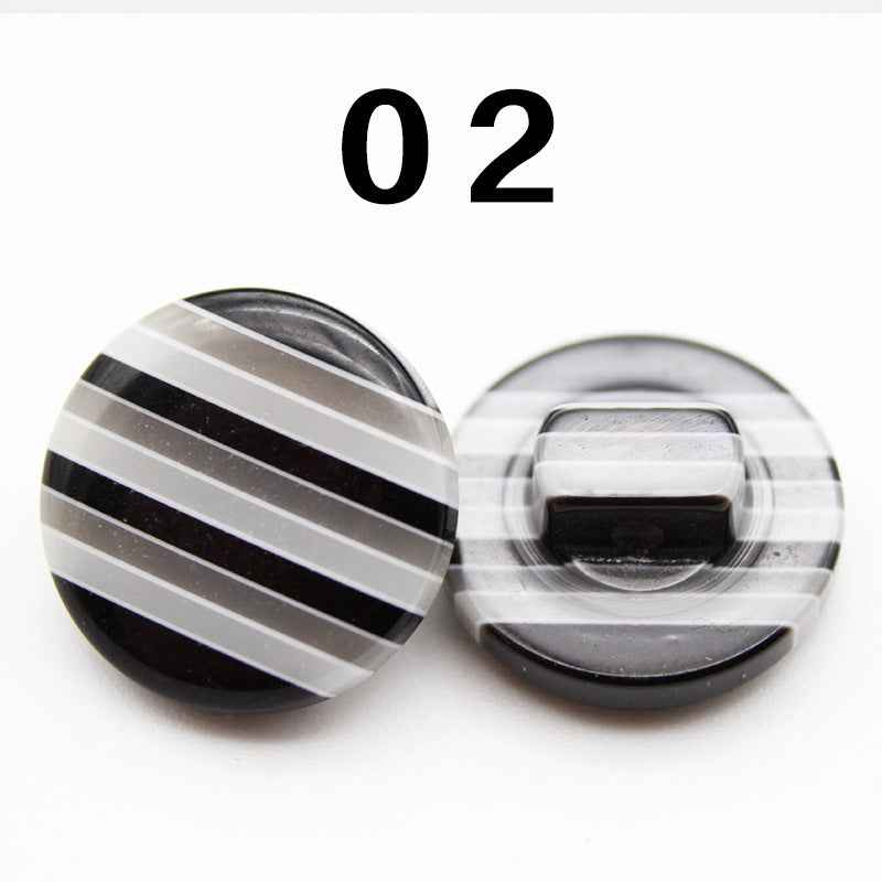 Color 02: black-and-white striped resin shirt button, round shank, front and back.