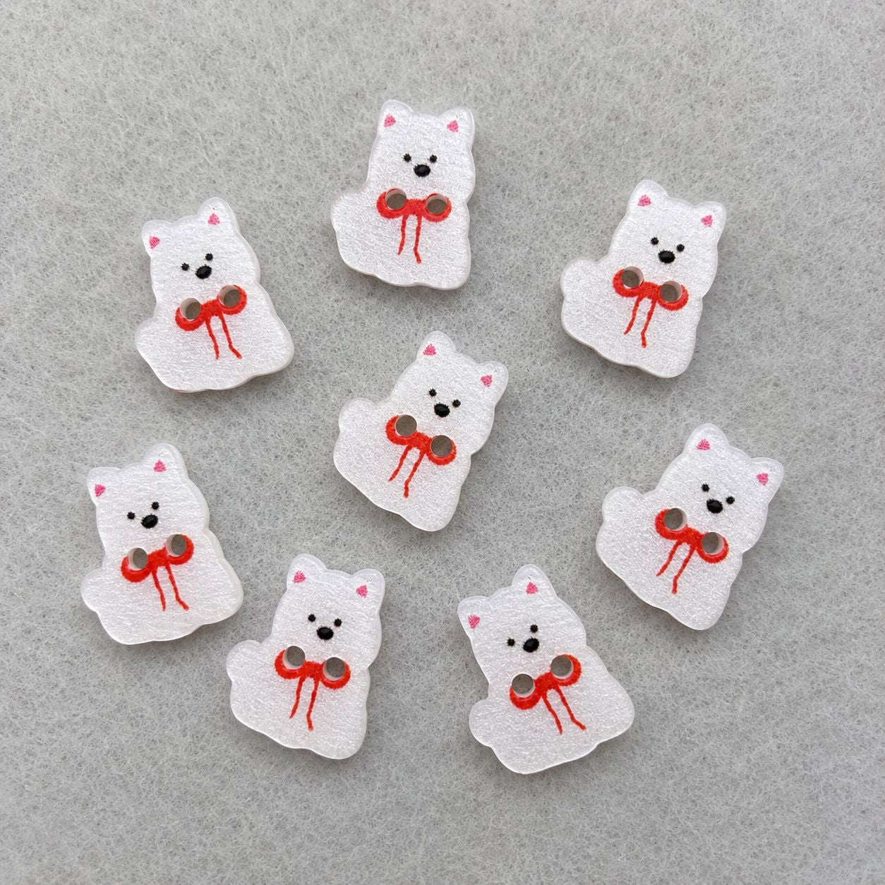 Set of white puppy dog resin buttons with red bows and black faces