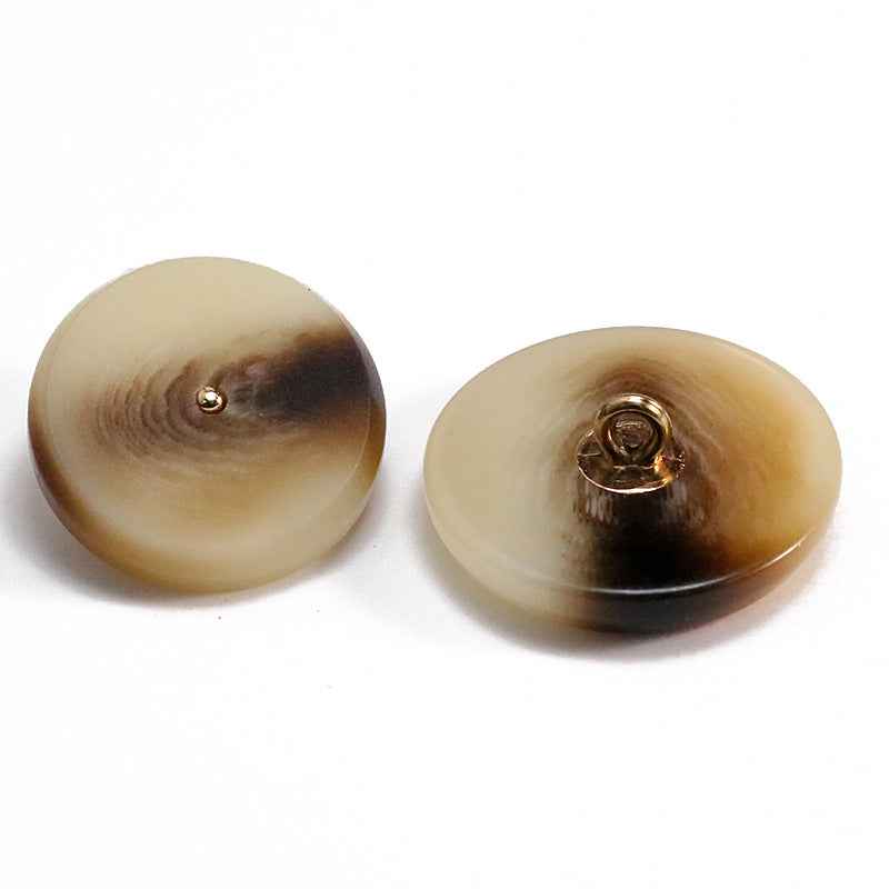 Two khaki round resin buttons with metal shanks and loop detail
