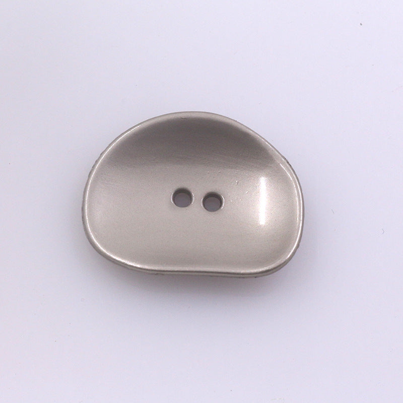 Irregular two-hole metal button, silver finish, rounded oval shape