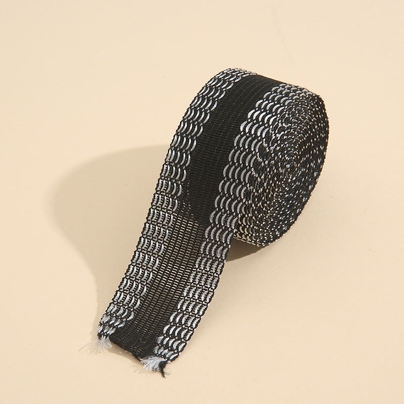 Black hem tape roll, textured looped edge design for ironing onto pant hems