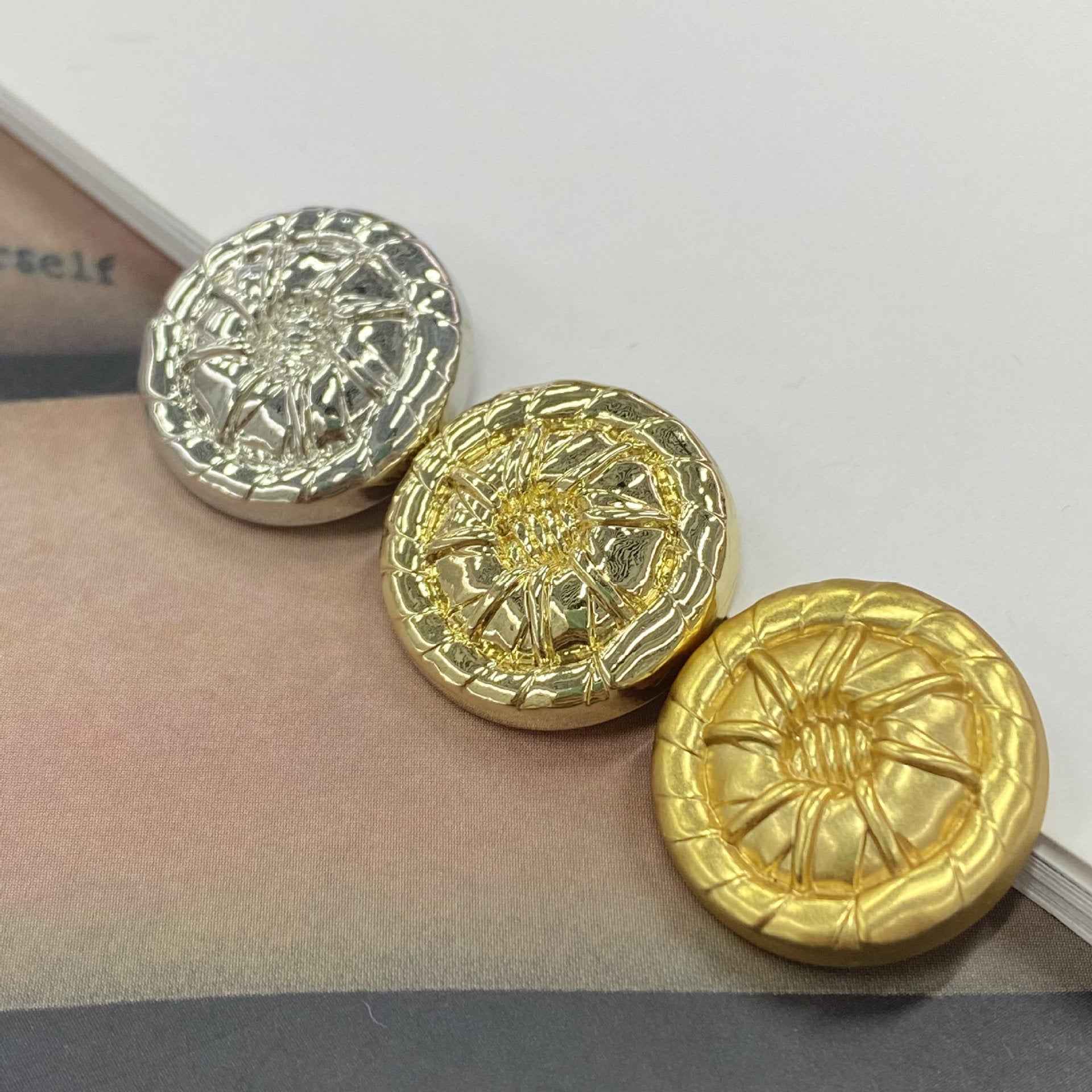 Set of round 3D metal shank buttons: gold and white-silver embossed floral pattern