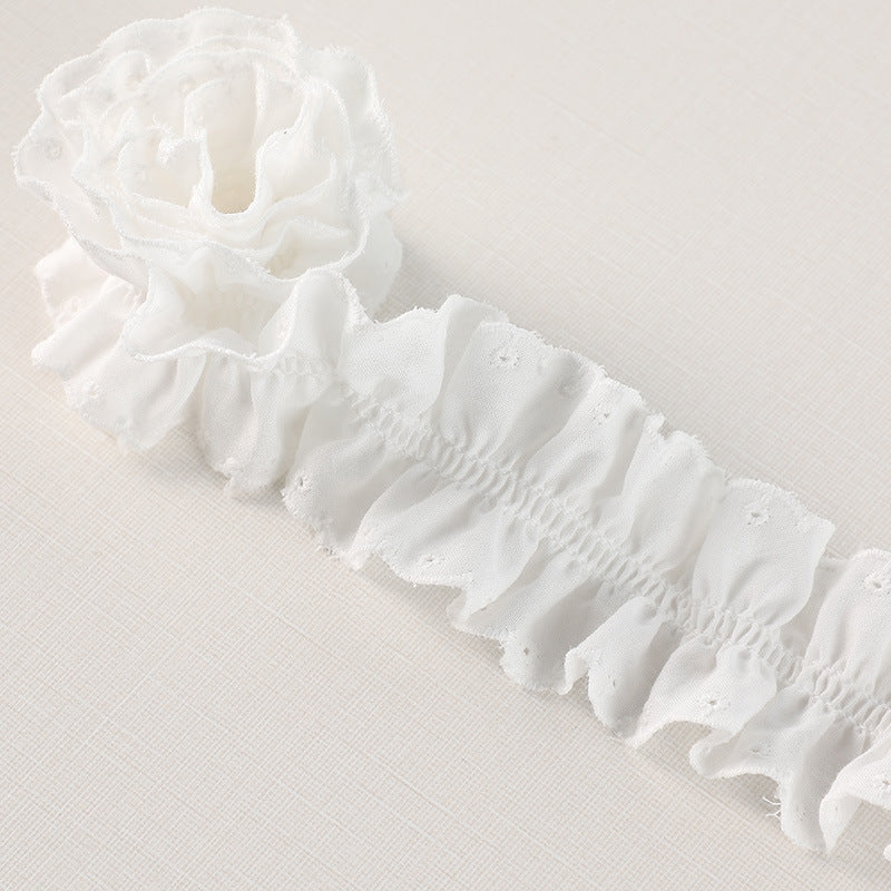 White cotton pleated lace trim, close view of gathered bands and scalloped eyelet lace