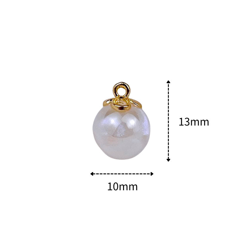 Pearl-shaped button, white round with gold ring shank; size 10mm x 13mm