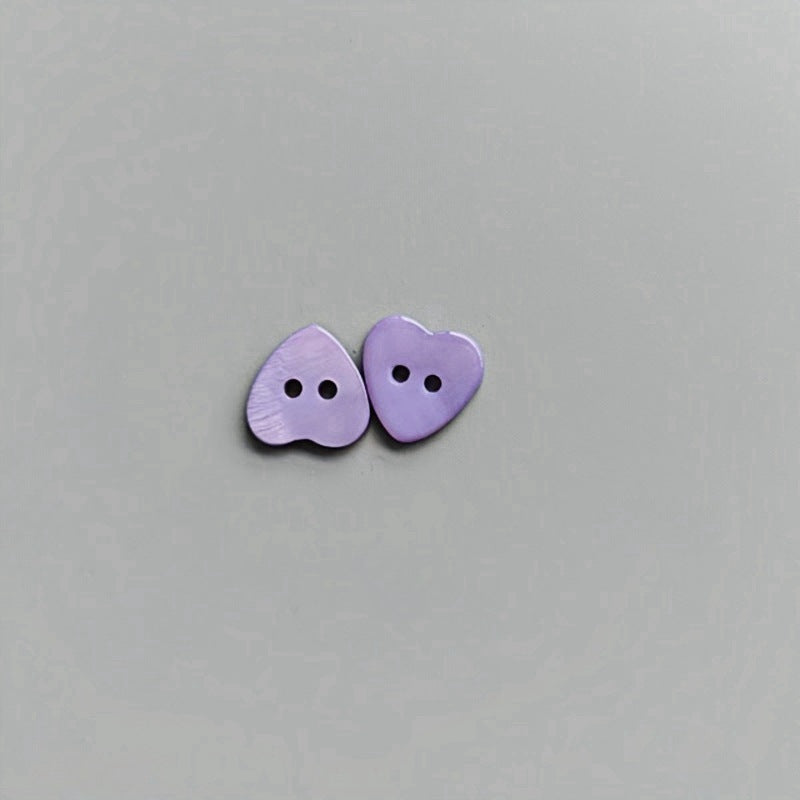 Purple heart-shaped 2-hole shirt buttons for children, two buttons shown.