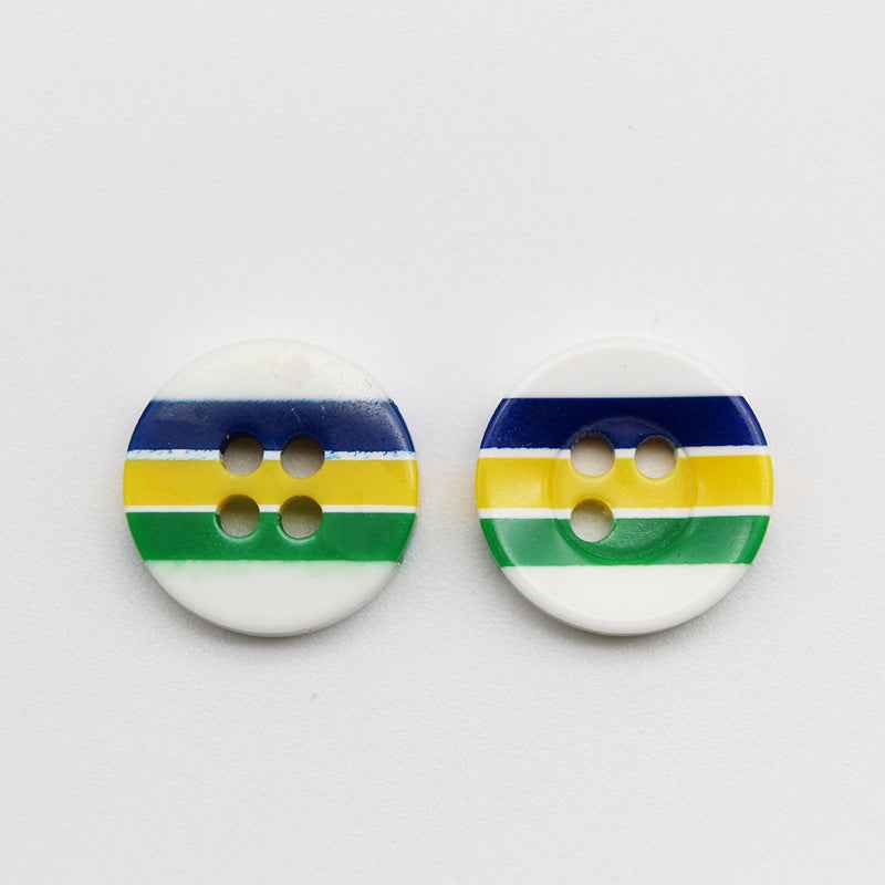 Two round resin buttons with 4 holes, candy stripes: blue, yellow, green on white