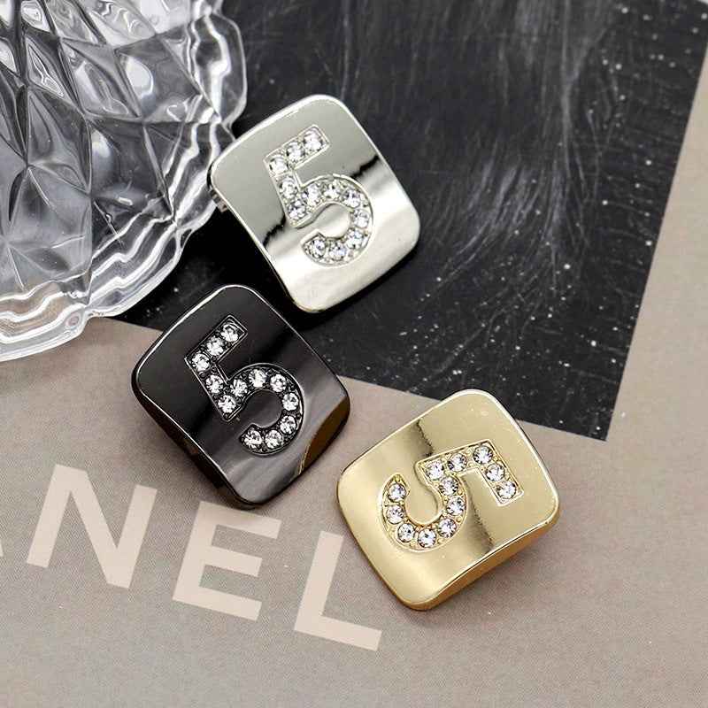 Set of Number 5 shank buttons: gunmetal, silver, and gold with rhinestones
