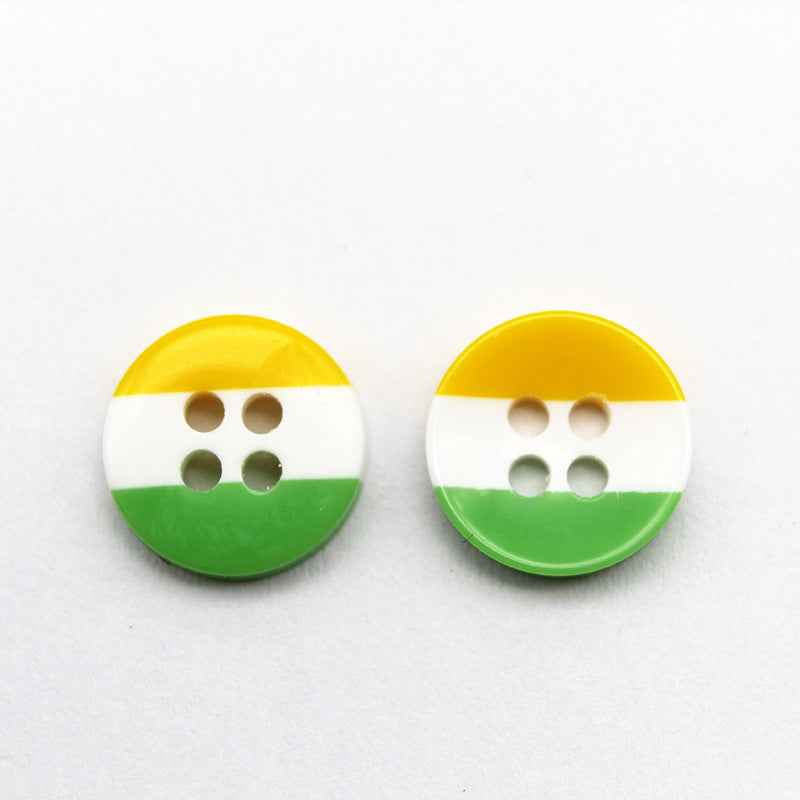 Round resin button with yellow top, white middle, and green bottom stripes; four holes.