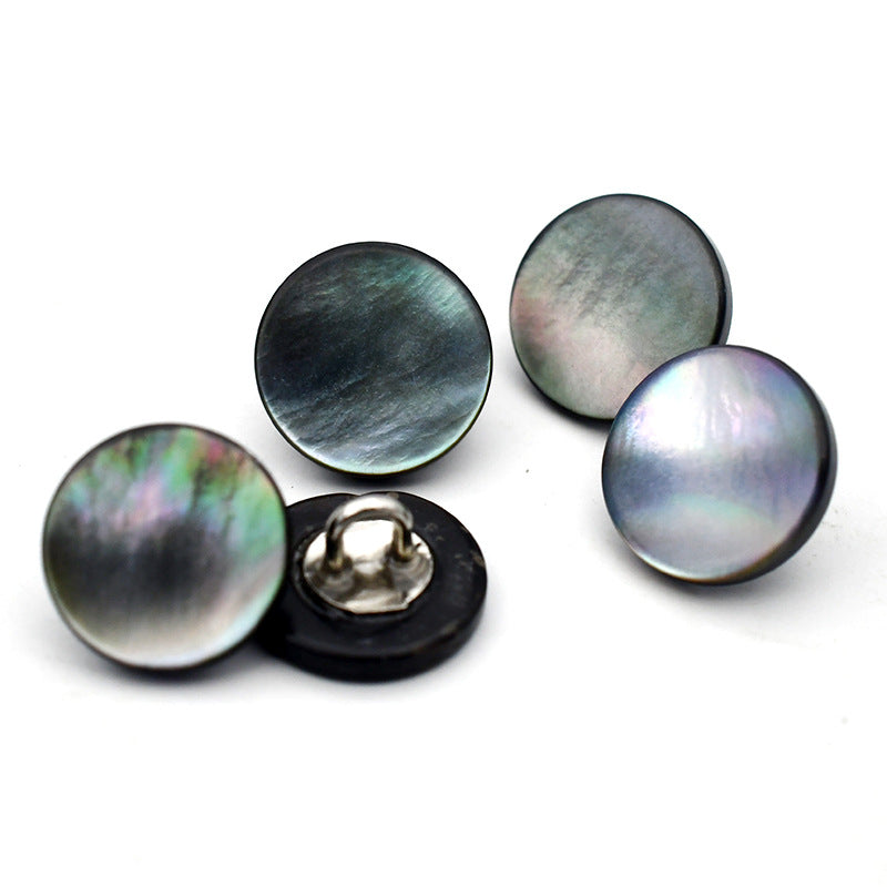 Assorted dark and iridescent shell round buttons with metal shank, mixed back views