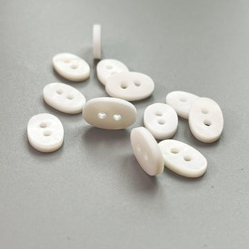 Natural white oval shell buttons, 32/34L, 2-hole set of 20—mixed shapes