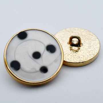 Gold round buttons with black dots on white, metal shank