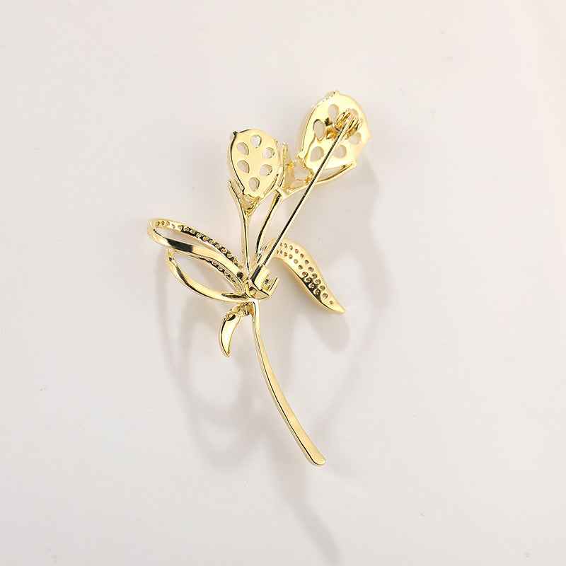 Tulip brooch with pin clasp, gold-tone motif and beige cat’s-eye stone