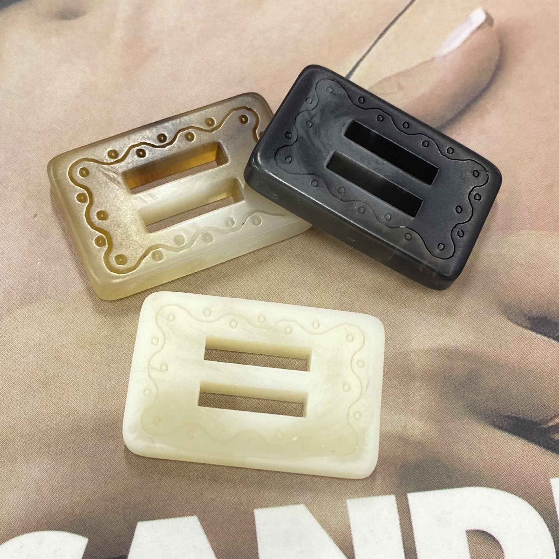 Rectangular resin 2-hole buckle buttons in light khaki/cream and dark gray-black