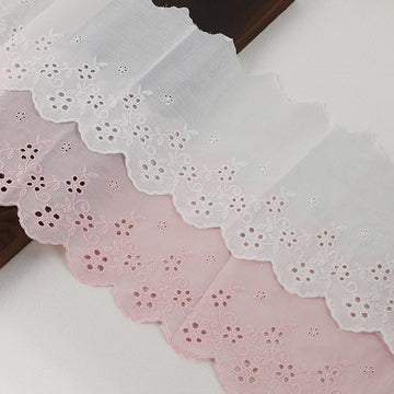 Cotton embroidered lace trim in white with scalloped edge and floral eyelet pattern