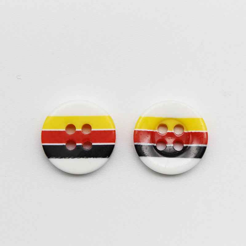 Two round resin buttons with 4 holes, candy stripes: yellow, red, black on white