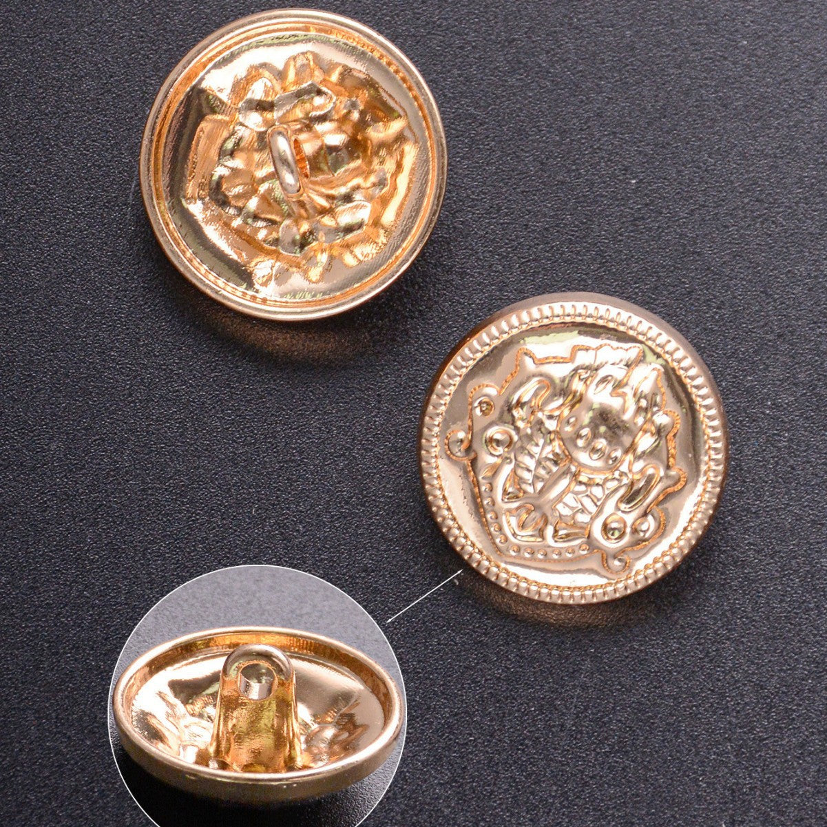 Gold metal shank buttons, embossed crest medallion front with matching shank back visible.