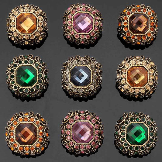 Rhinestone coat shank buttons, gold-tone frames with amber, pink, orange, green and blue-grey stones