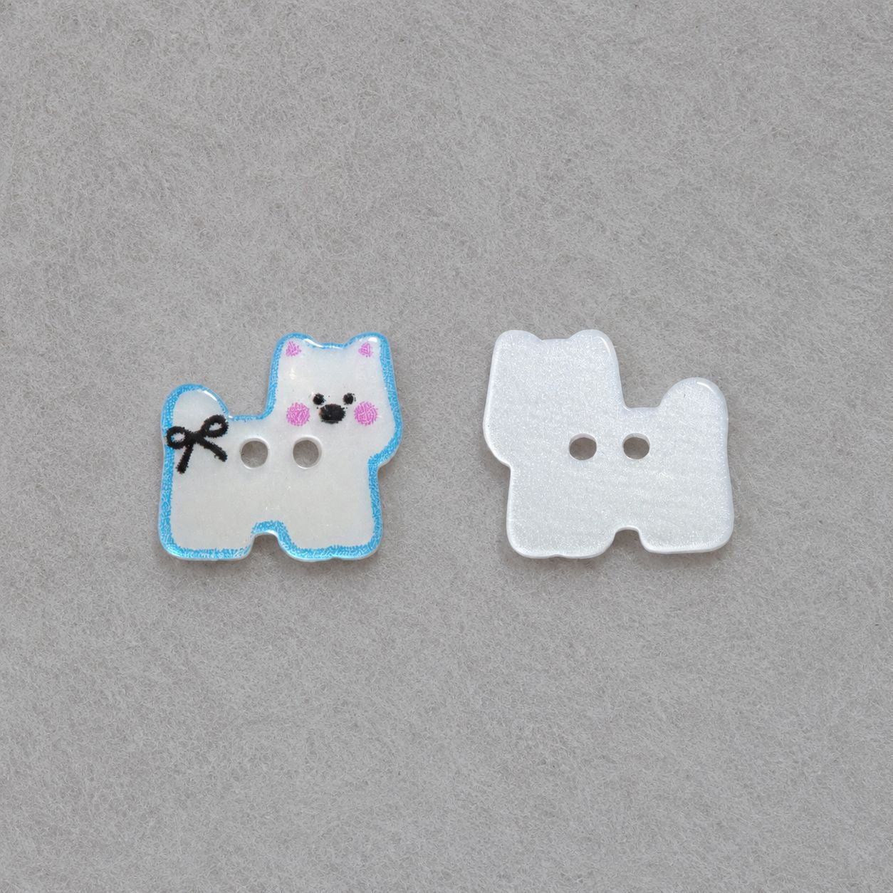 Blue-and-white puppy resin button and white puppy resin button, each with two holes