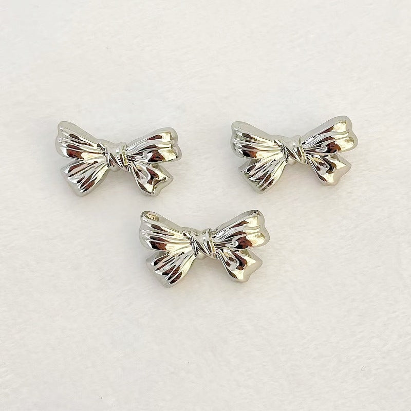 Nickel bowknot metal shank buttons, hand-sew; two silver bows plus one angled bow