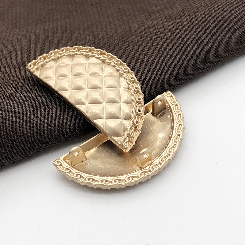 Sand gold metal shank button, semi-circle front with textured surface (side view)