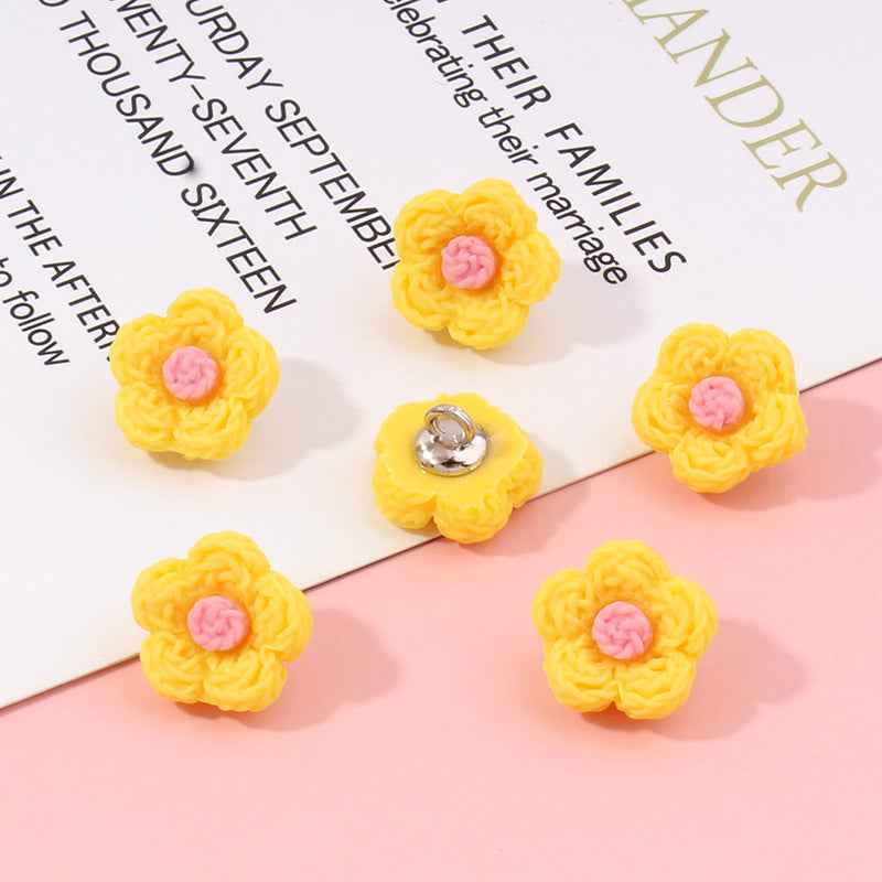 Yellow flower plastic buttons, 13mm; pink centers, silver backs