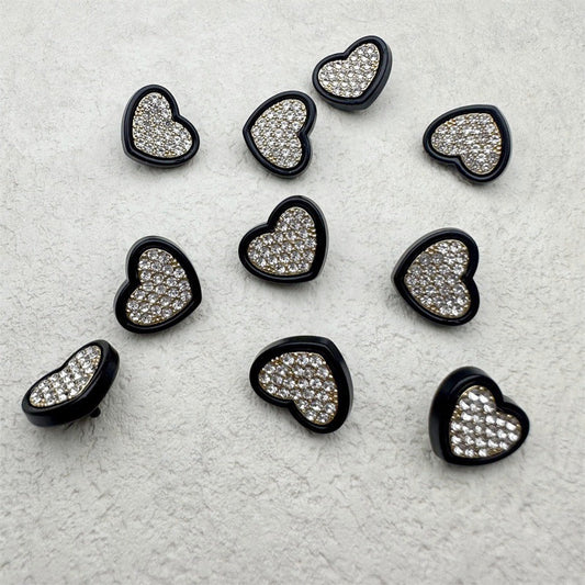 Heart-shaped rhinestone buttons, black metal edges, clear crystals, multiple pieces