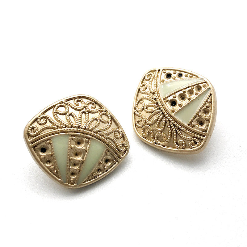 Gold-tone metal shank button with light green/blue glass and rhinestone trim