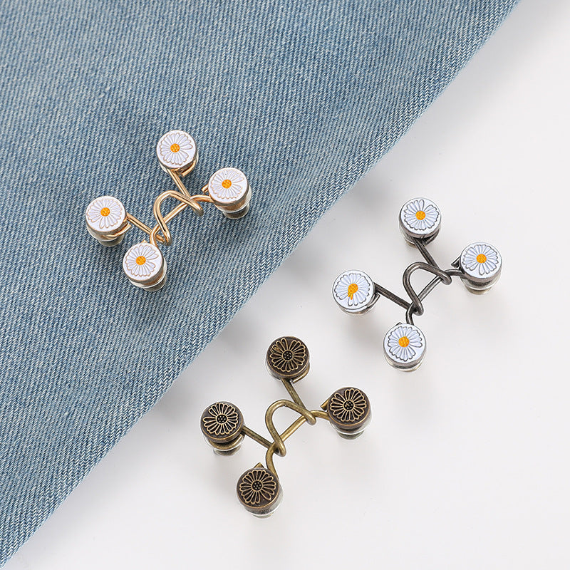 Daisy-pattern jean waist tightener buttons in gold and silver finishes, linked loops