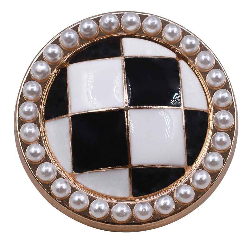 Gold-tone round metal button with black-and-white checkered face and pearl border