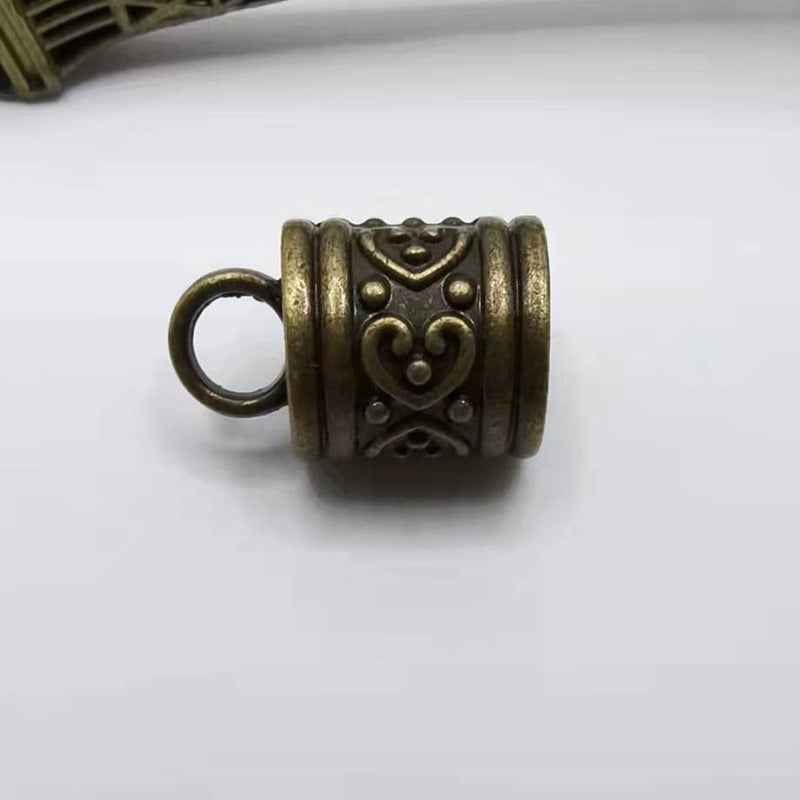 Bronze antique cylinder bell cord end cap with heart motif and loop ring
