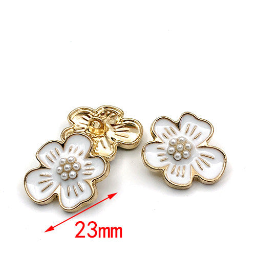 23mm gold flower-shaped metal shank buttons with white pearl center.