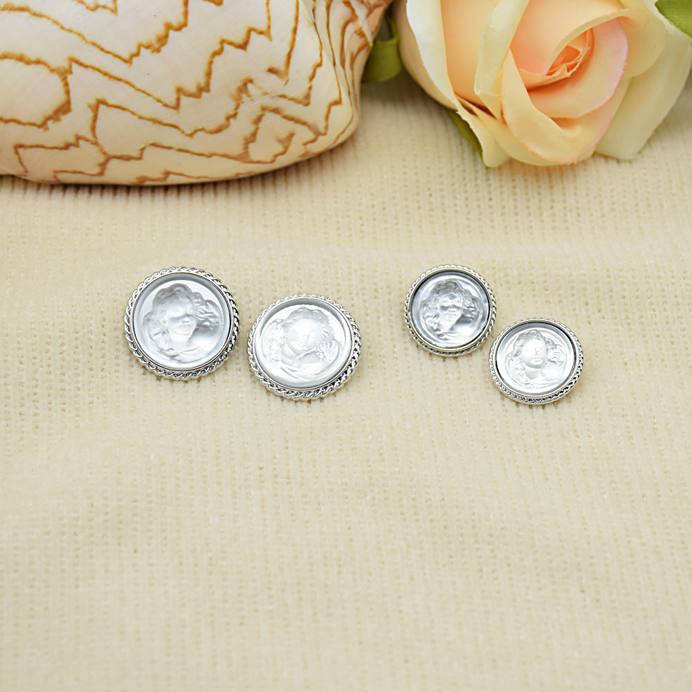 Clear silver lady portrait resin buttons with silver rims; 4 round buttons with decorative border.