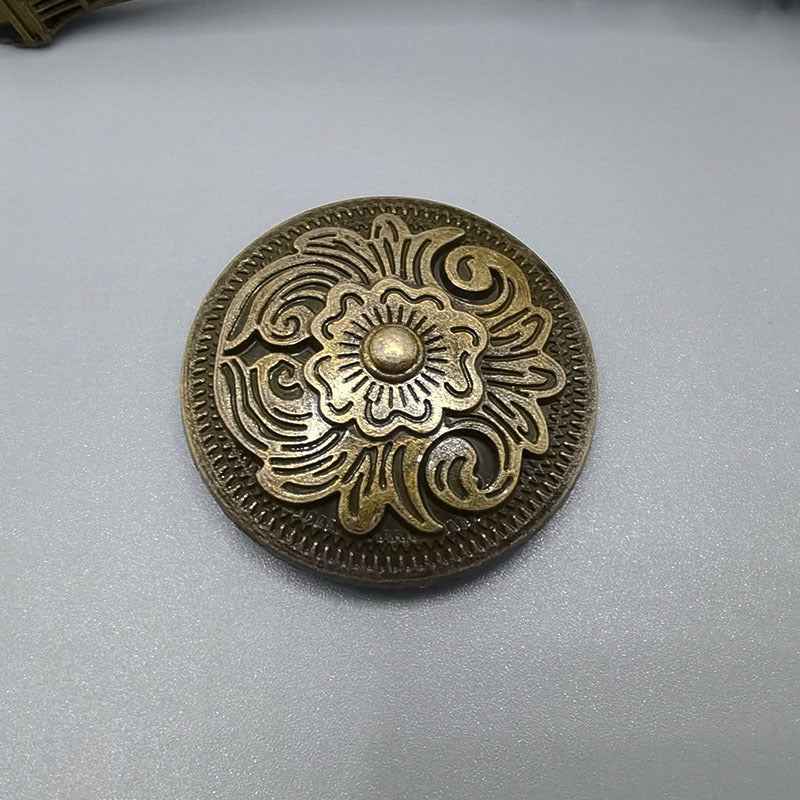 Round bronze arabesque screw-back stud button with floral swirl engraving