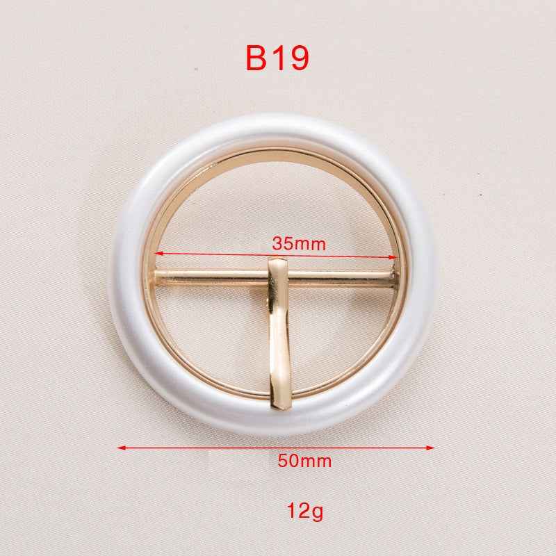 Pearl white resin ring belt buckle with gold-toned T-bar and circular frame
