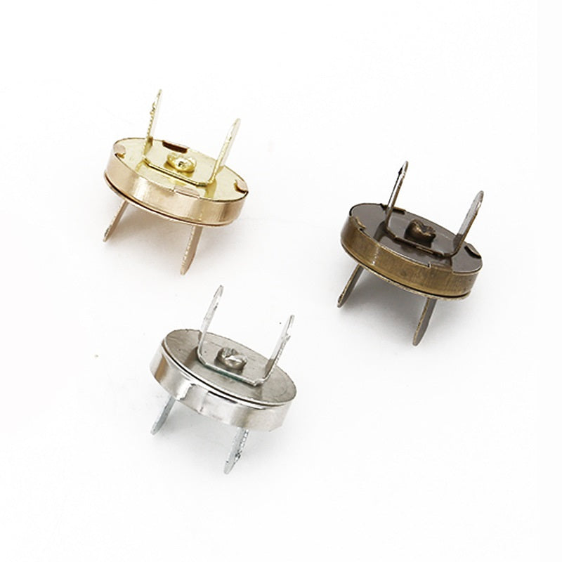 Round magnetic snap buttons in gold and silver, plus gun-black pair