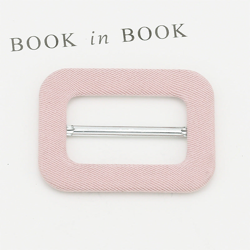 Fabric-covered D-ring buckle for belt adjustment, pink fabric with silver metal bar