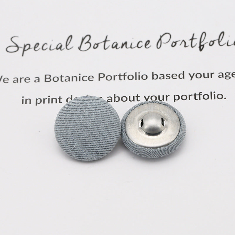 Gray fabric-covered shank buttons: round top and underside with metal shank
