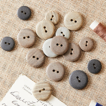Round two-hole eco-resin buttons, mix of light grey and dark grey tones