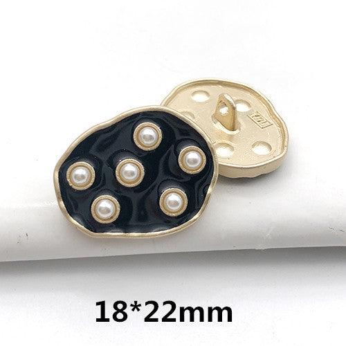 18x22mm gold-tone back with navy round front, pearl dot accents and central button holes