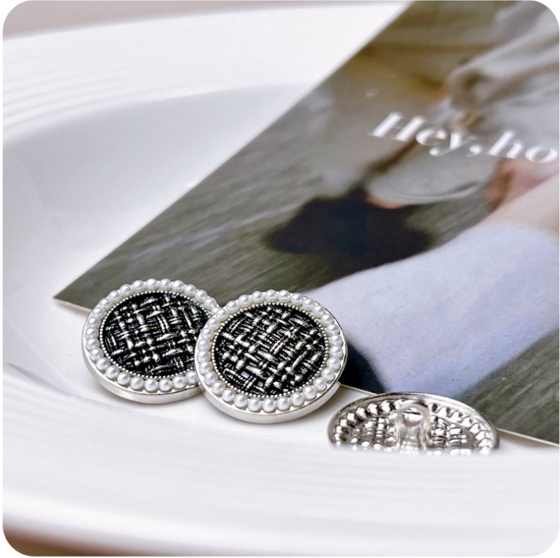 Round pearl-edged tweed check button pair, black fabric, silver tone metal shank