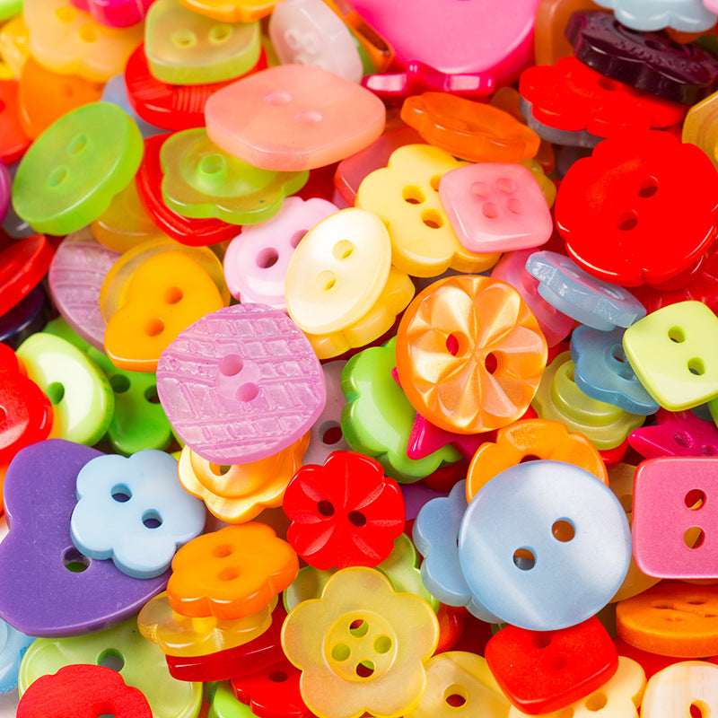 Close-up of candy-colored craft buttons with 2–4 holes in mixed shapes.