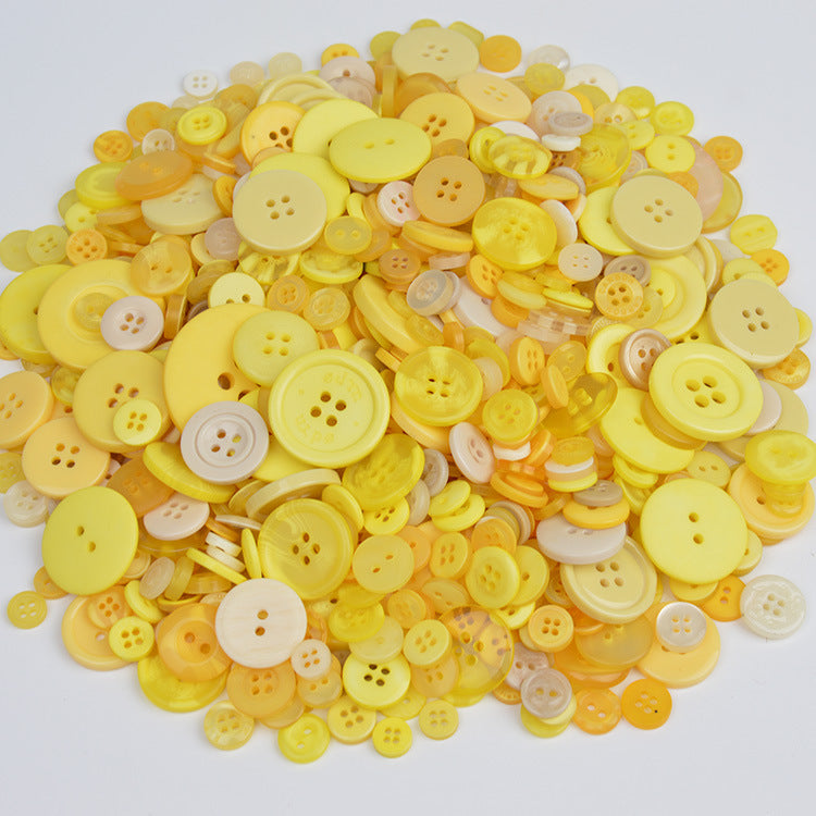 Yellow resin craft buttons pile with round 4-hole and 2-hole buttons
